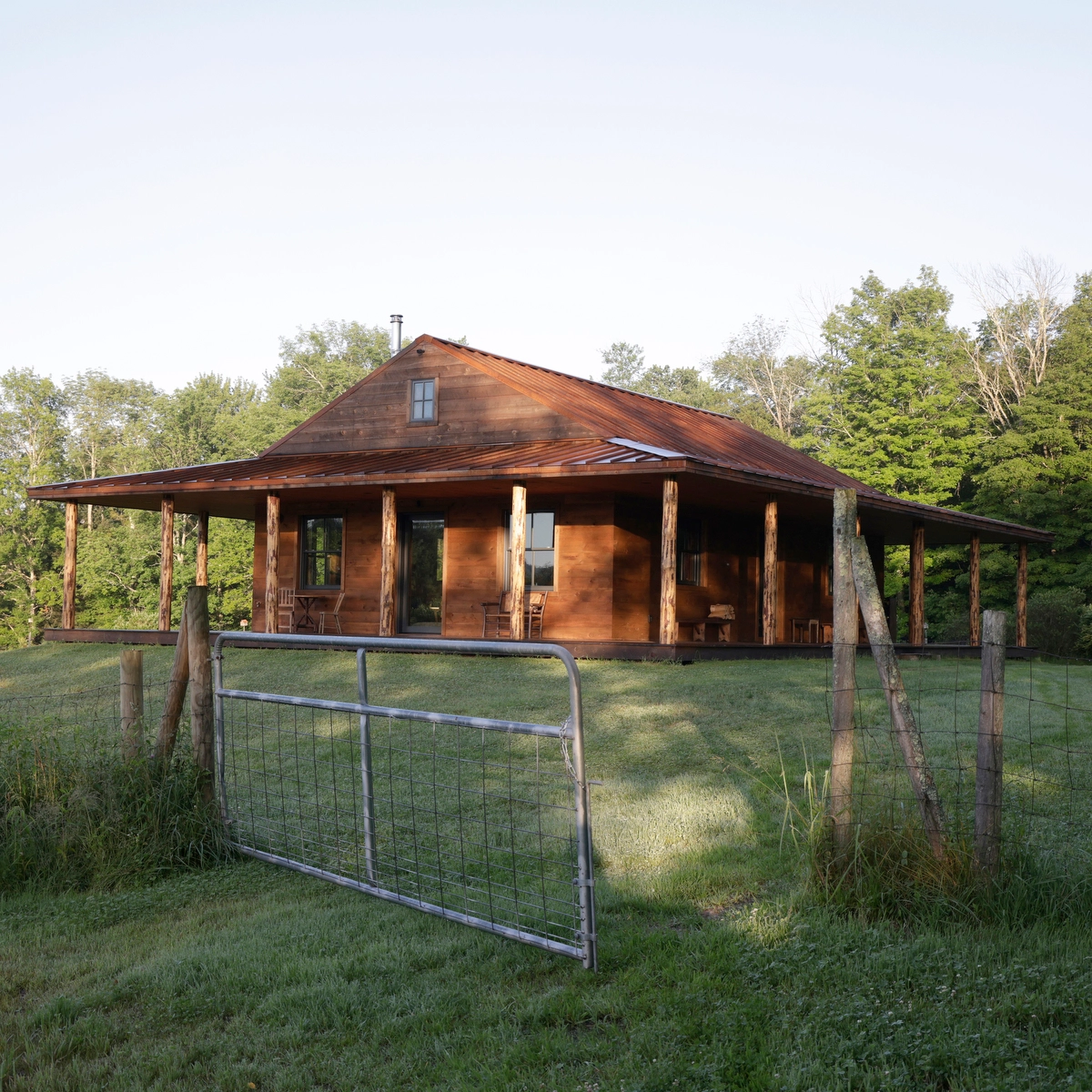 rustic cabin in the Catskills with a benchmark pine porch