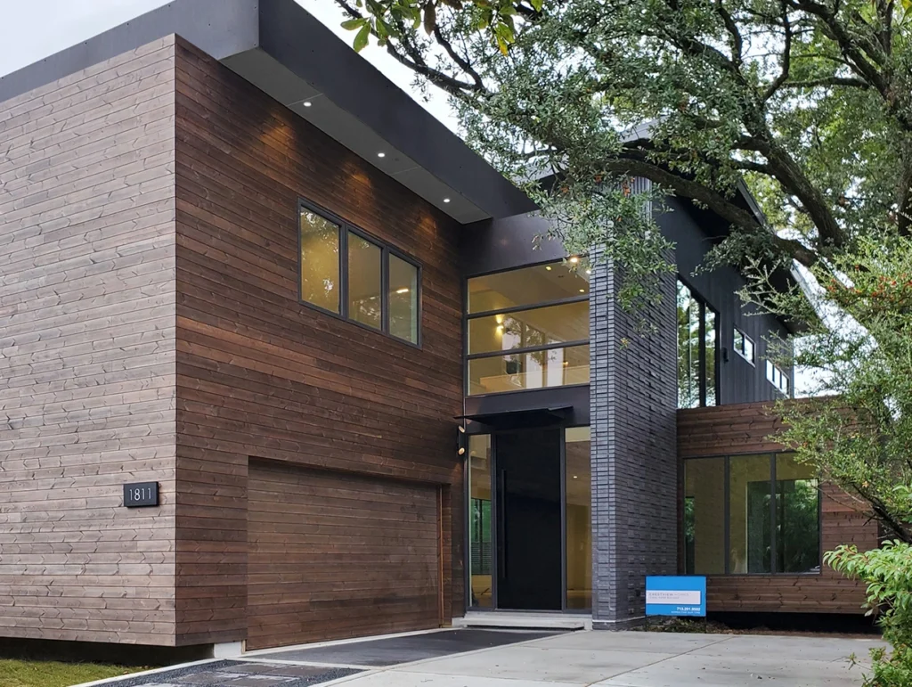 Benchmark Pine by Thermory Cladding finished home with Cutek oil