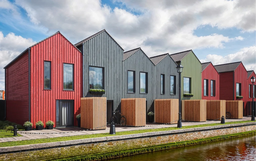 Multi-colored homes with cladding finished Vivid by Thermory