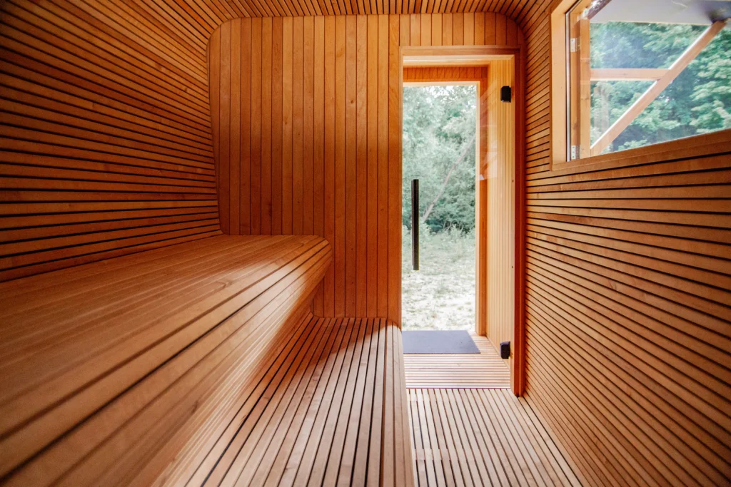 Thermory thermo-aspen sauna interior with open door