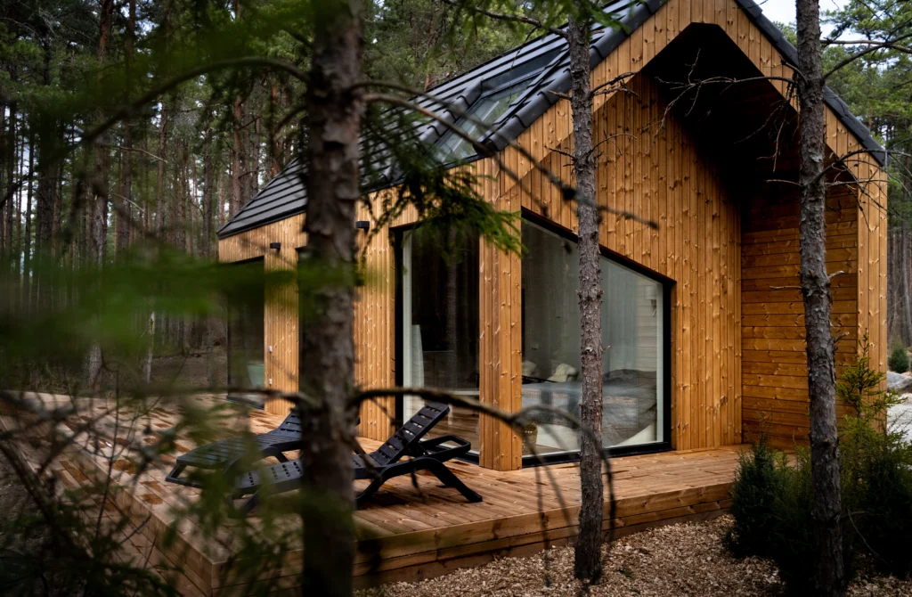 closeup of cladding and patio made from benchmark pine, WUUD House