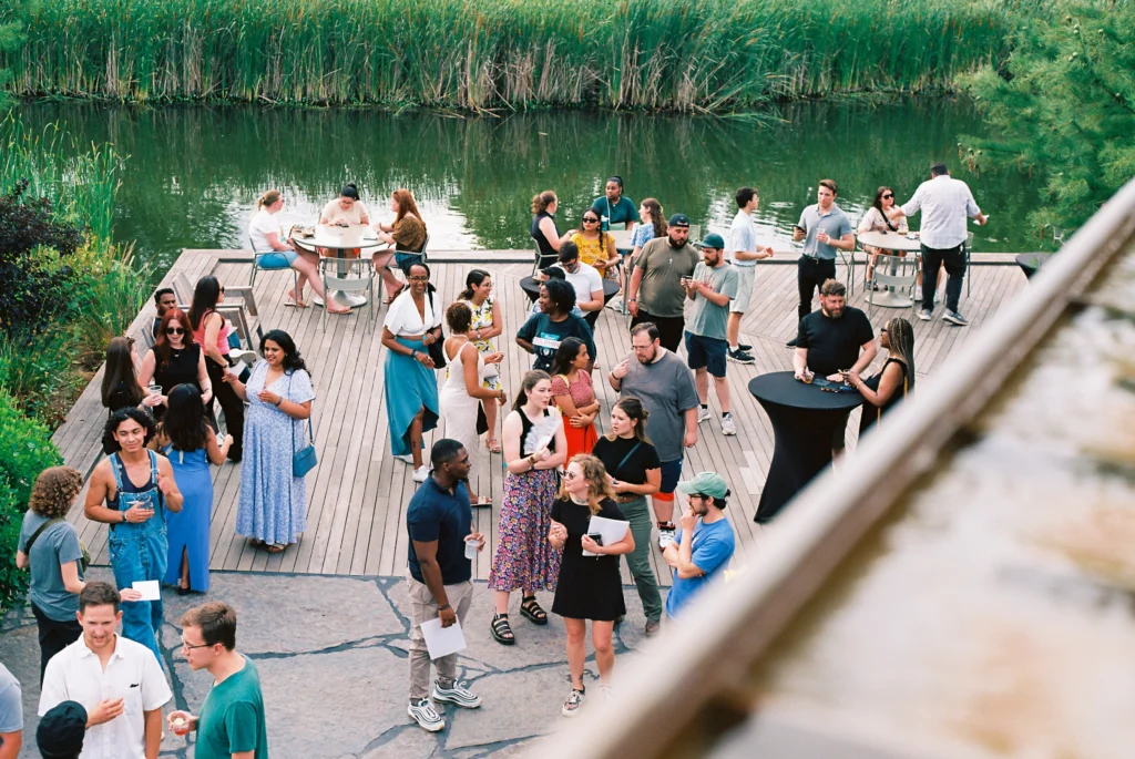 the gathering place decking made with benchmark ash full of people mingling