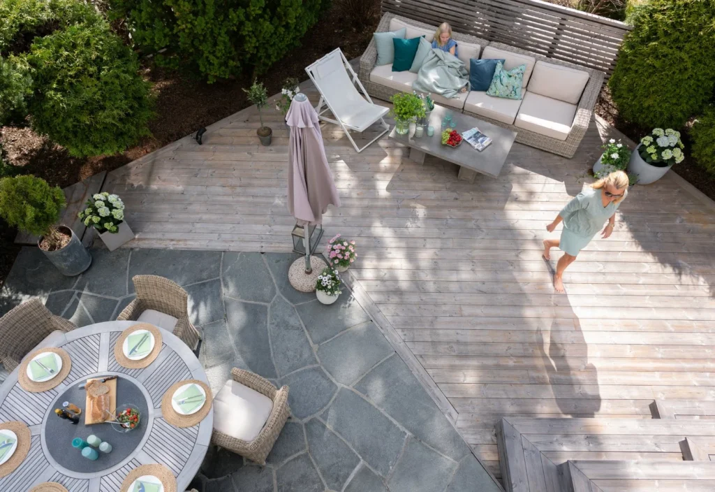 benchmark pine decking patio with woman walking on it with bare feet