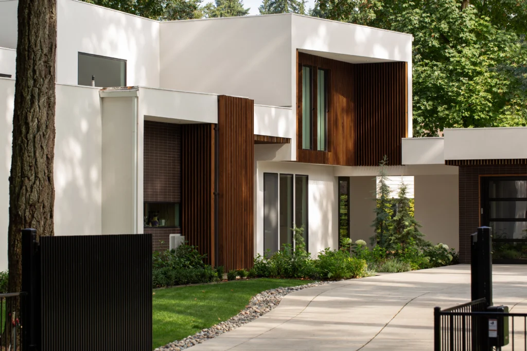 Benchmark Clear Pine Cladding and slats against a white concrete exterior