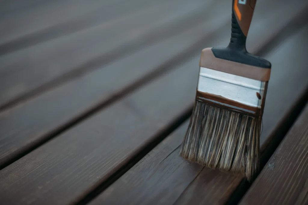 deck with a surface applied treatment being applied